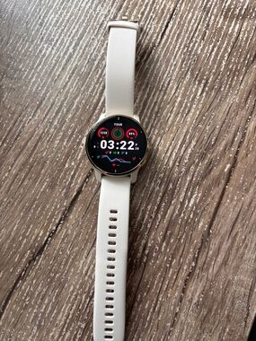 garmin Round Smartwatch with Cream Silicone Strap and Gold Bezel